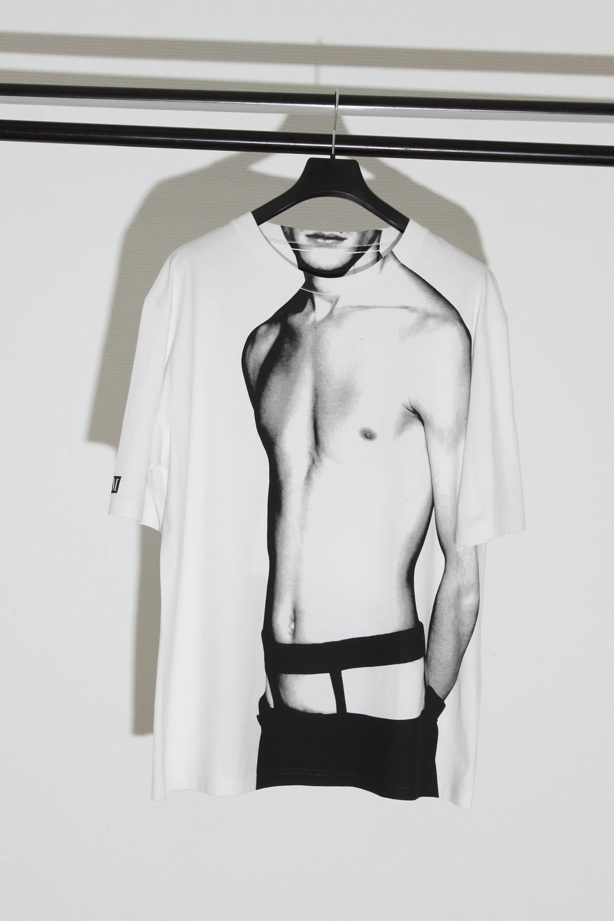 Front view of the Memorabilia white cotton T-shirt by Sébastien Meunier, featuring an oversized printed male torso.